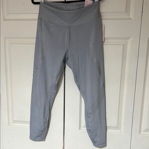 Victoria’s Secret Leggings with Silver shiny details size Large.